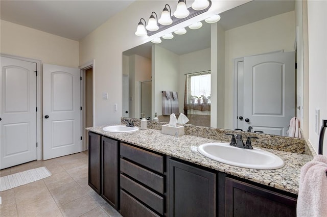 bathroom with vanity and tile patterned flooring