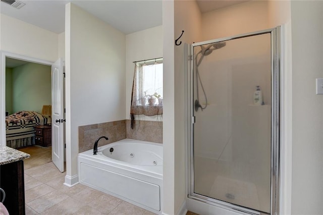 bathroom with vanity, independent shower and bath, and tile patterned flooring