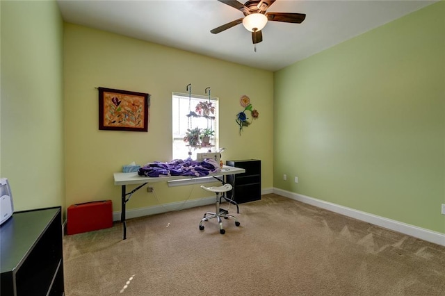 office area featuring ceiling fan and light colored carpet