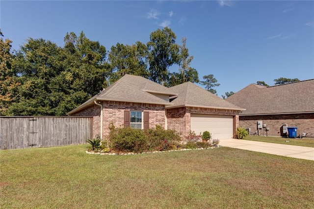 view of front of house featuring a front yard and a garage