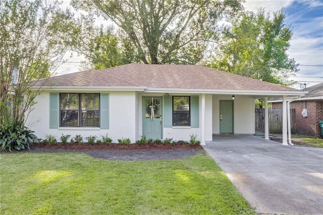 single story home with a front lawn and a carport