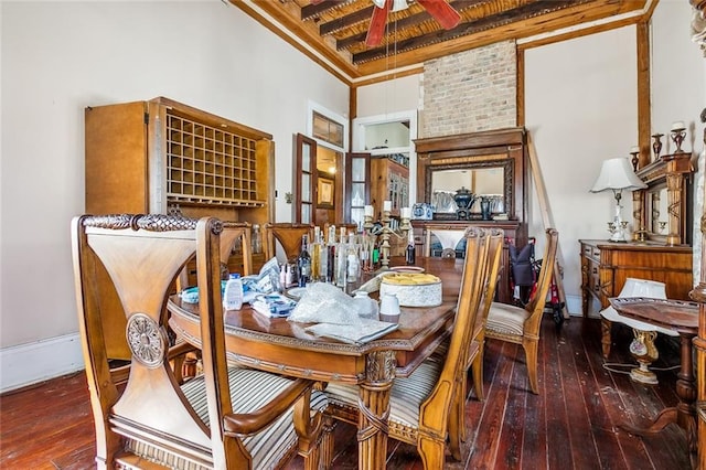 dining space with beamed ceiling, ornamental molding, hardwood / wood-style flooring, and ceiling fan