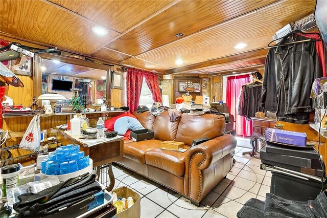 interior space featuring wooden walls, wood ceiling, and light tile patterned floors