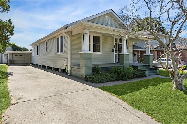 bungalow-style house featuring an outbuilding