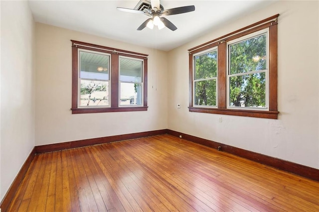 spare room featuring ceiling fan and wood-type flooring