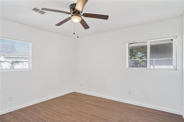 unfurnished room with wood-type flooring and ceiling fan