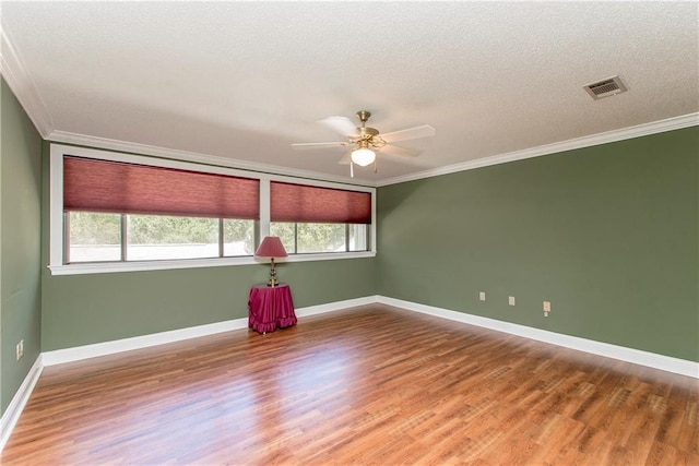 64 Fairway View Dr Unit 1, Hammond, LA 70401 - spare room with visible vents, wood finished floors, ceiling fan, and ornamental molding