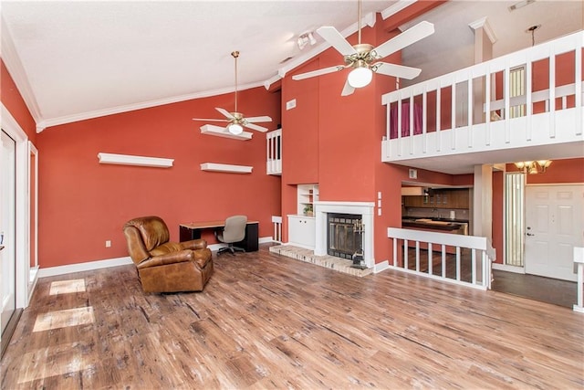 64 Fairway View Dr Unit 1, Hammond, LA 70401 - living area with a fireplace, ceiling fan, high vaulted ceiling, crown molding, and wood finished floors