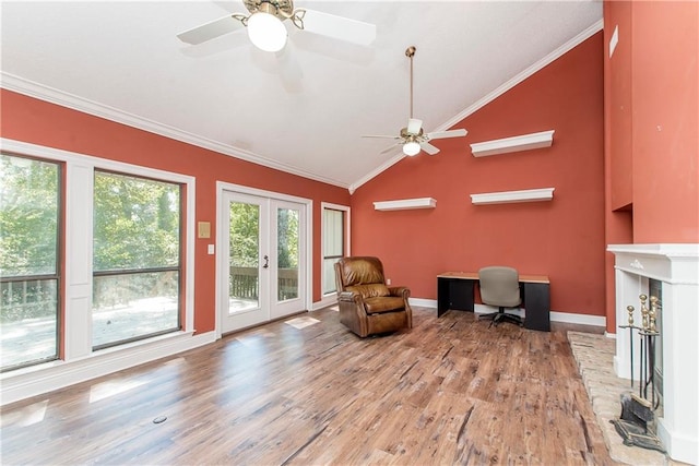64 Fairway View Dr Unit 1, Hammond, LA 70401 - living area with wood finished floors, ornamental molding, a brick fireplace, french doors, and lofted ceiling