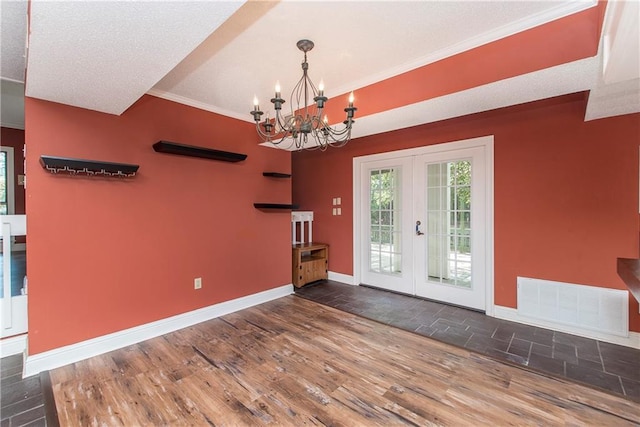 64 Fairway View Dr Unit 1, Hammond, LA 70401 - empty room featuring a chandelier, visible vents, baseboards, french doors, and wood finished floors