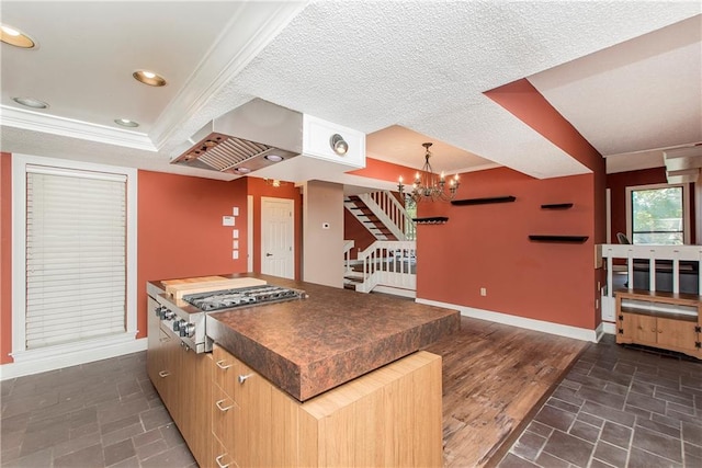64 Fairway View Dr Unit 1, Hammond, LA 70401 - kitchen with a raised ceiling, dark countertops, baseboards, an inviting chandelier, and stainless steel gas cooktop