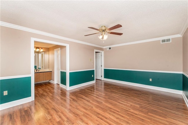64 Fairway View Dr Unit 1, Hammond, LA 70401 - empty room with wood finished floors, visible vents, a ceiling fan, and a textured ceiling