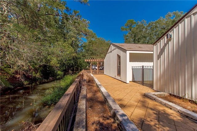 64 Fairway View Dr Unit 1, Hammond, LA 70401 - view of property exterior featuring a patio and a pergola