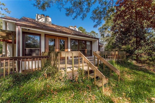 64 Fairway View Dr Unit 1, Hammond, LA 70401 - back of property with a deck and a chimney