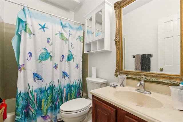 full bathroom featuring vanity, shower / bath combo, and toilet