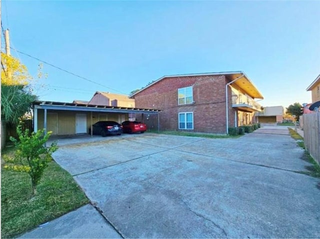 view of property exterior with a carport