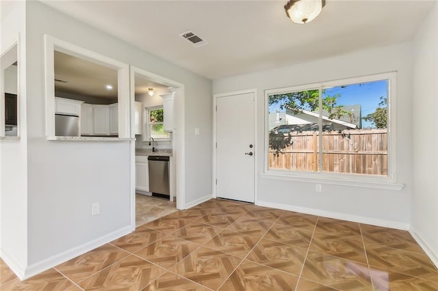 foyer with light parquet floors