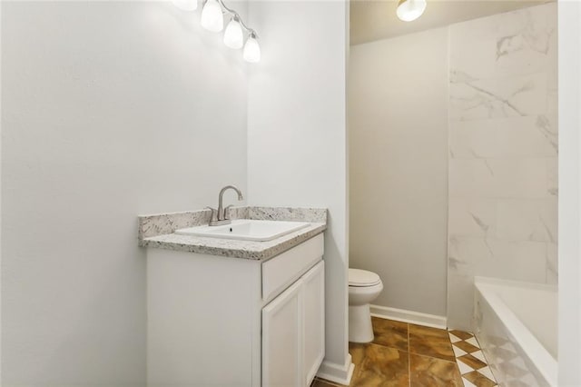 bathroom with a bathtub, toilet, tile patterned flooring, and vanity