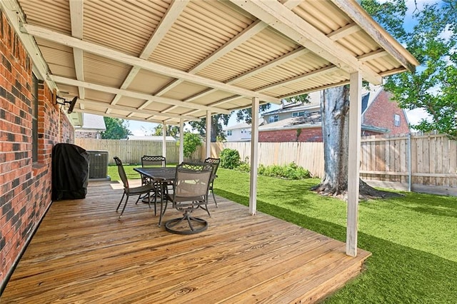 deck featuring a yard and area for grilling