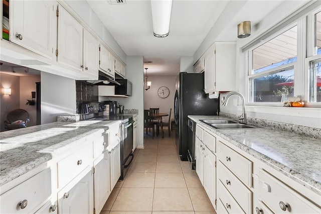 kitchen featuring backsplash, sink, black appliances, light tile patterned flooring, and white cabinets