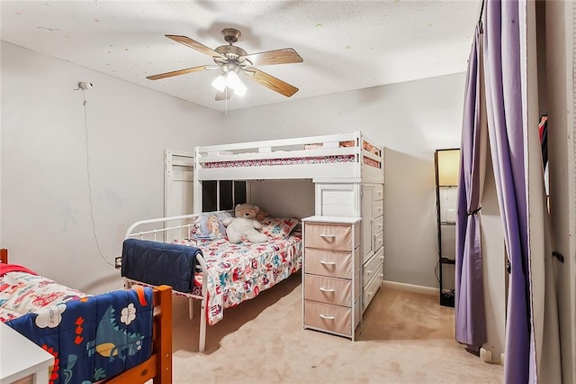 bedroom featuring light carpet and ceiling fan