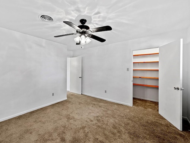 carpeted empty room with ceiling fan