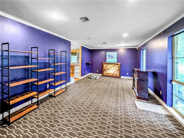 interior space featuring carpet floors and ornamental molding