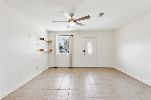 foyer featuring light tile patterned floors and ceiling fan