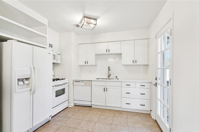 kitchen featuring sink, light tile patterned floors, white appliances, decorative backsplash, and white cabinets