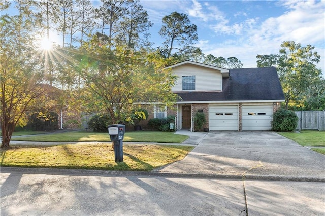 view of front facade with a front yard and a garage