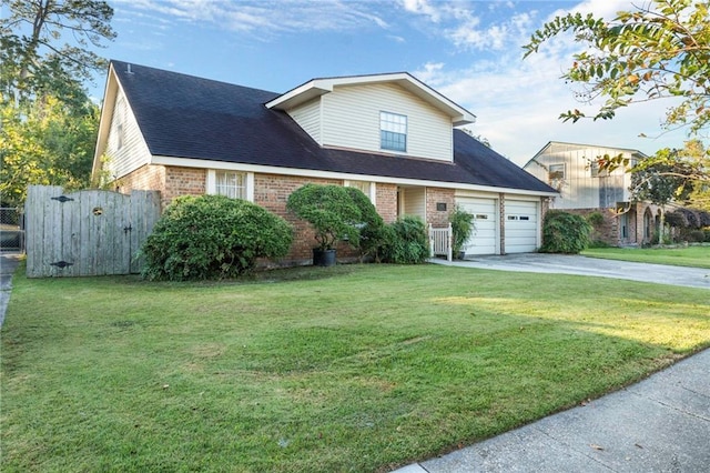 view of front of house featuring concrete driveway, brick siding, a front yard, and a gate