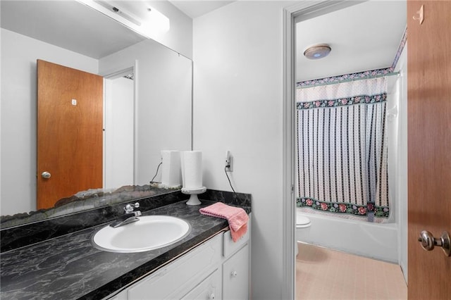 full bathroom featuring vanity, shower / tub combo, and toilet