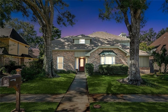 view of front of home with a lawn