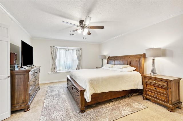 bedroom featuring ceiling fan, a textured ceiling, ornamental molding, and light colored carpet