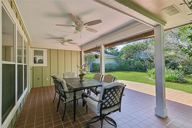 sunroom / solarium with ceiling fan and a wealth of natural light