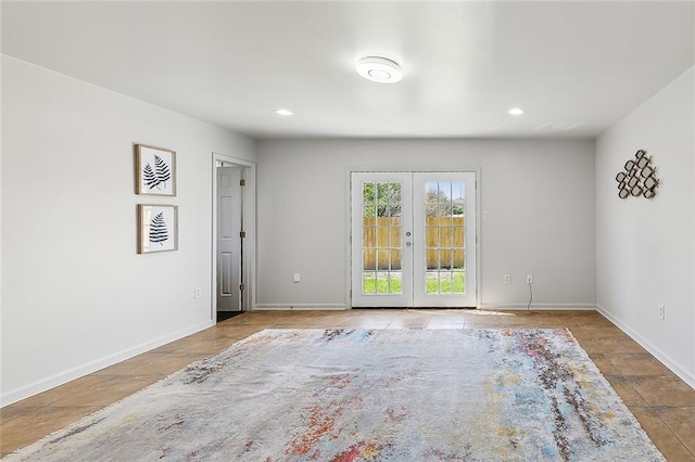 unfurnished room with french doors