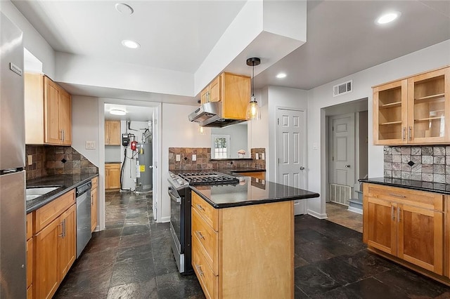 kitchen featuring decorative light fixtures, stainless steel appliances, and backsplash