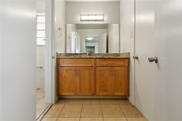 bathroom featuring vanity and tile patterned flooring