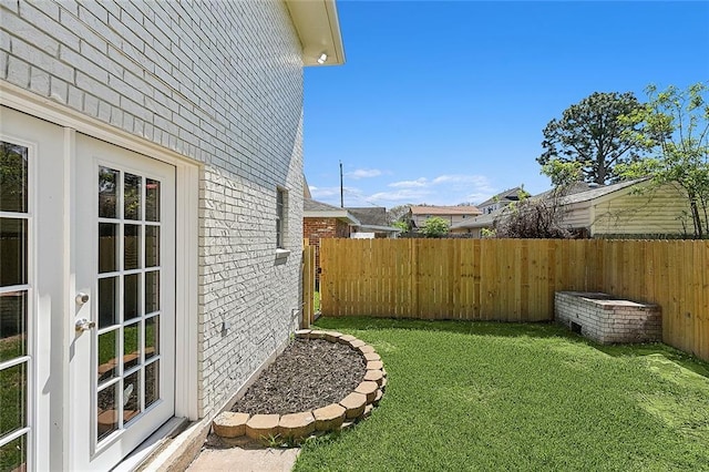 view of yard featuring french doors