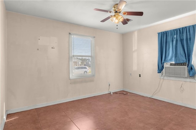 spare room featuring cooling unit, tile patterned floors, and ceiling fan