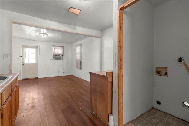 laundry room with dark wood-type flooring, cooling unit, and hookup for a washing machine