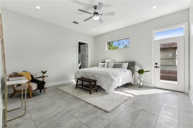 bedroom with ceiling fan, multiple windows, and access to exterior