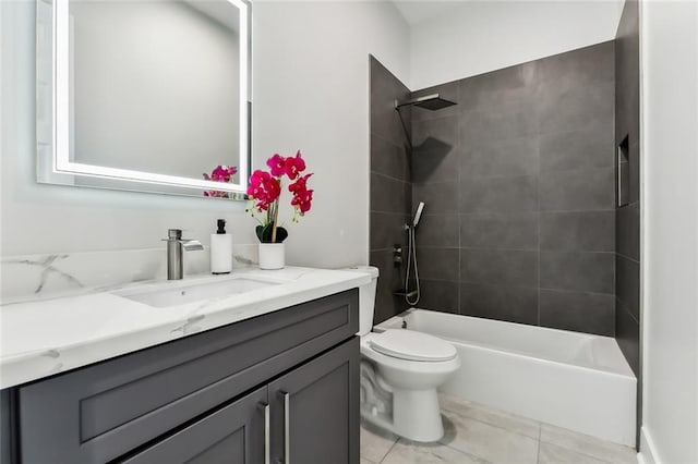 full bathroom with vanity, tiled shower / bath, and toilet