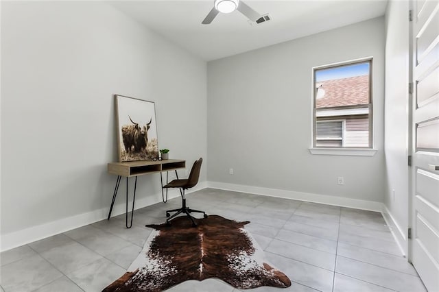 home office with ceiling fan and light tile patterned flooring