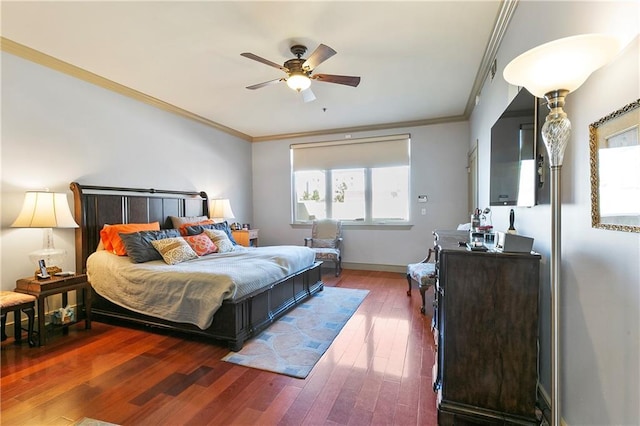 bedroom featuring ceiling fan, hardwood / wood-style flooring, and ornamental molding