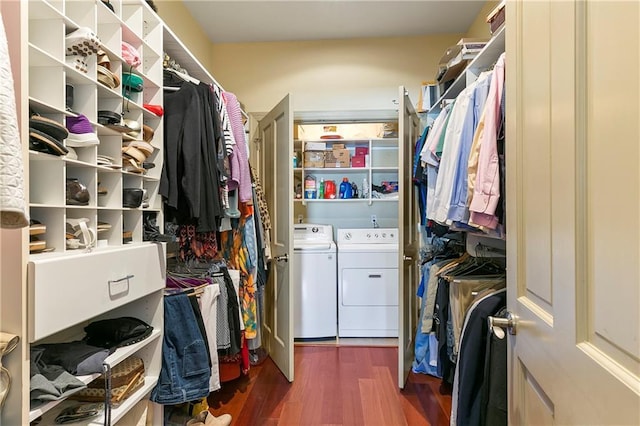 walk in closet featuring washer and clothes dryer and dark hardwood / wood-style floors