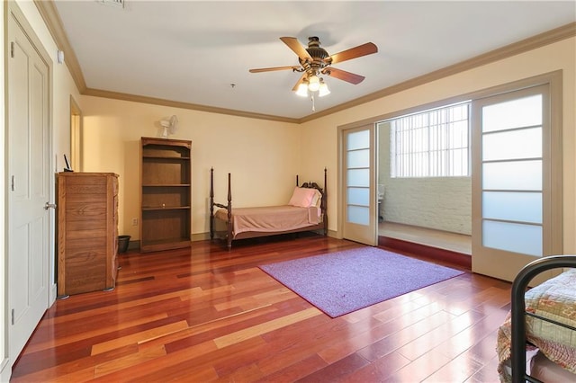 bedroom with ceiling fan, crown molding, and wood-type flooring