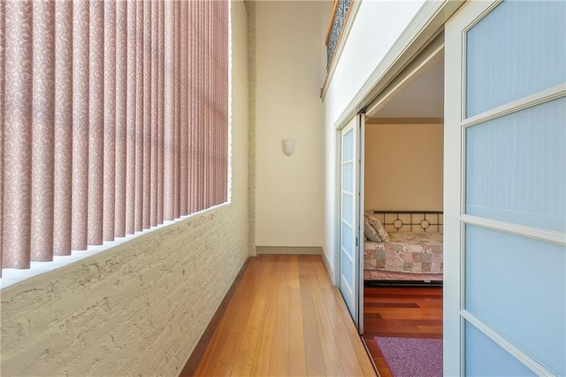 hall with hardwood / wood-style floors