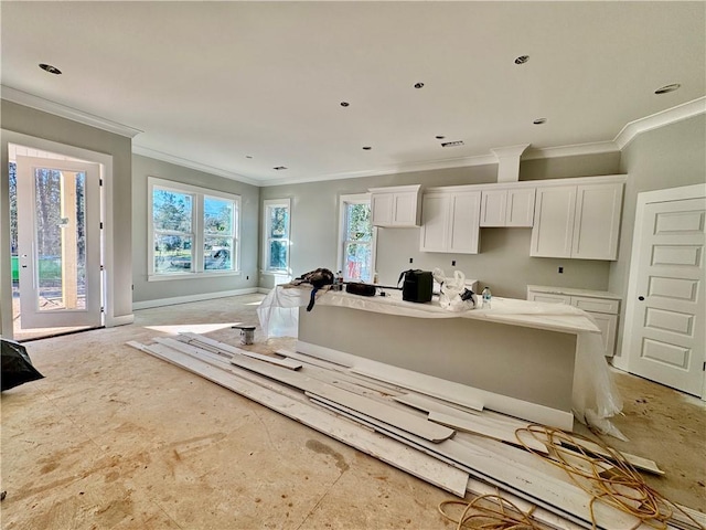 kitchen featuring white cabinetry and crown molding