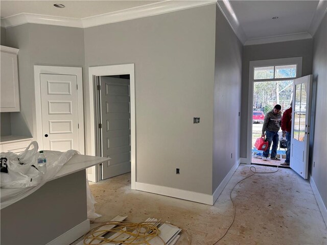 interior space featuring white cabinetry and ornamental molding